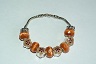 Bracelet fantaisie Fleurs / ton orange - marron clair